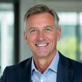Portrait of Mark Jensen, a calm and approachable man in his 50s
